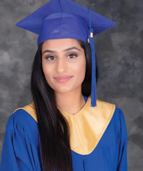 Harmeen wearing her graduation gown. She graduated with honor as an MLA.