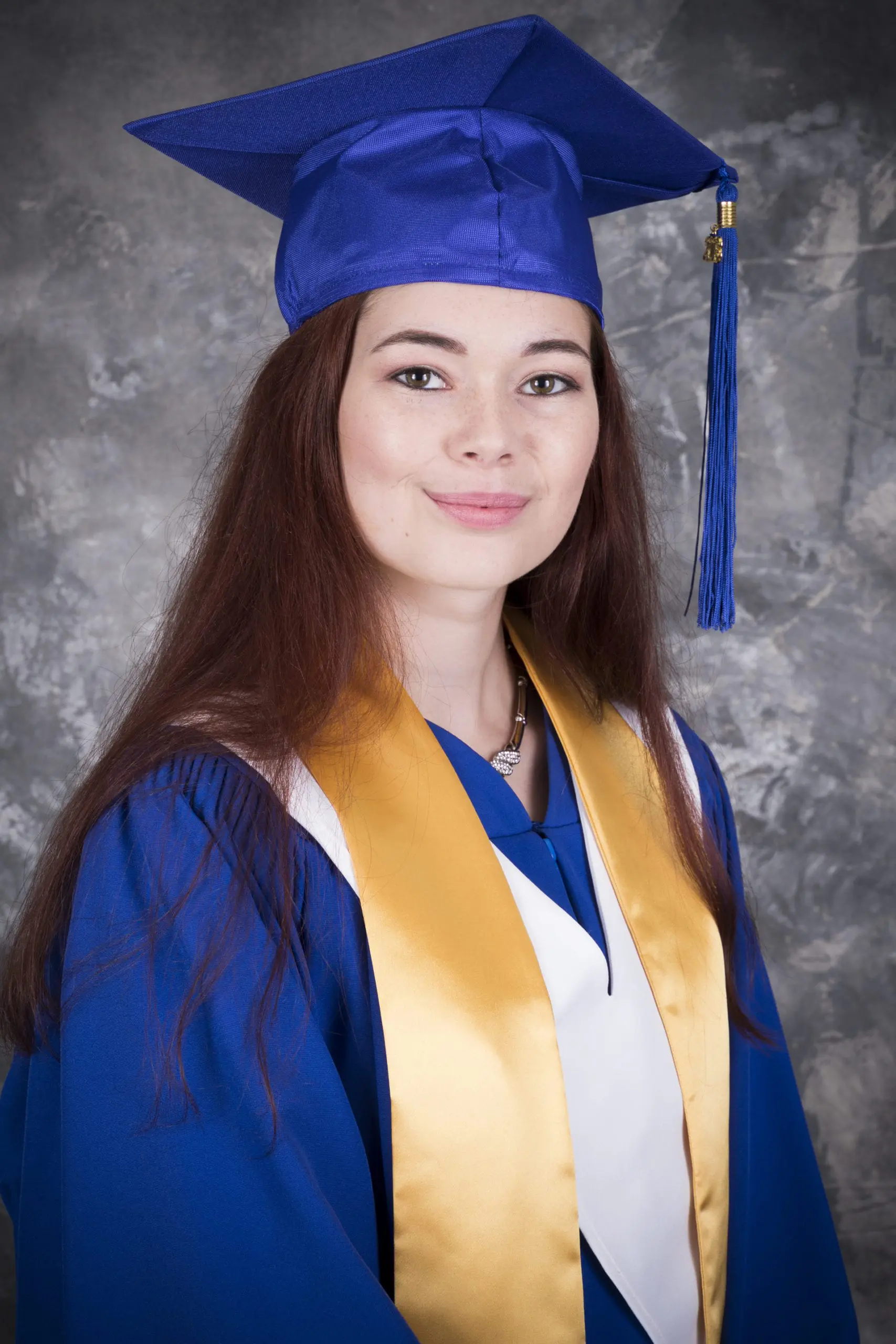 Heather Pincombe in Graduation Regalia smiles confident with the prospects of her new career in health care.