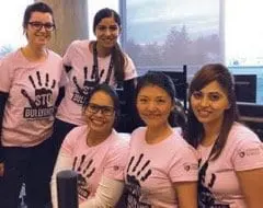 Lin Bi and her classmates of Stenberg's Nursing Unit Clerk program wearing pink to stand against bullying on Pink Shirt Day.