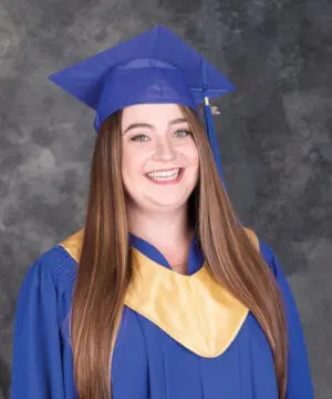 Sammi smiled confidently with her Student of the Year gown. She overcame a lot to become an Early Childhood Educator.