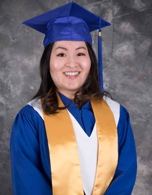 Jasmine smiles in Grad Gown. She is now a Licensed Optician.