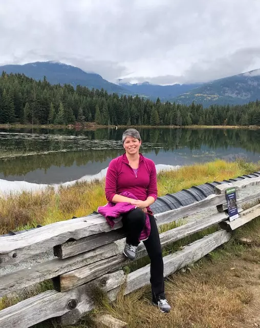 Lori taking a break by the lake, one of her tips on Managing a Busy Schedule and School.