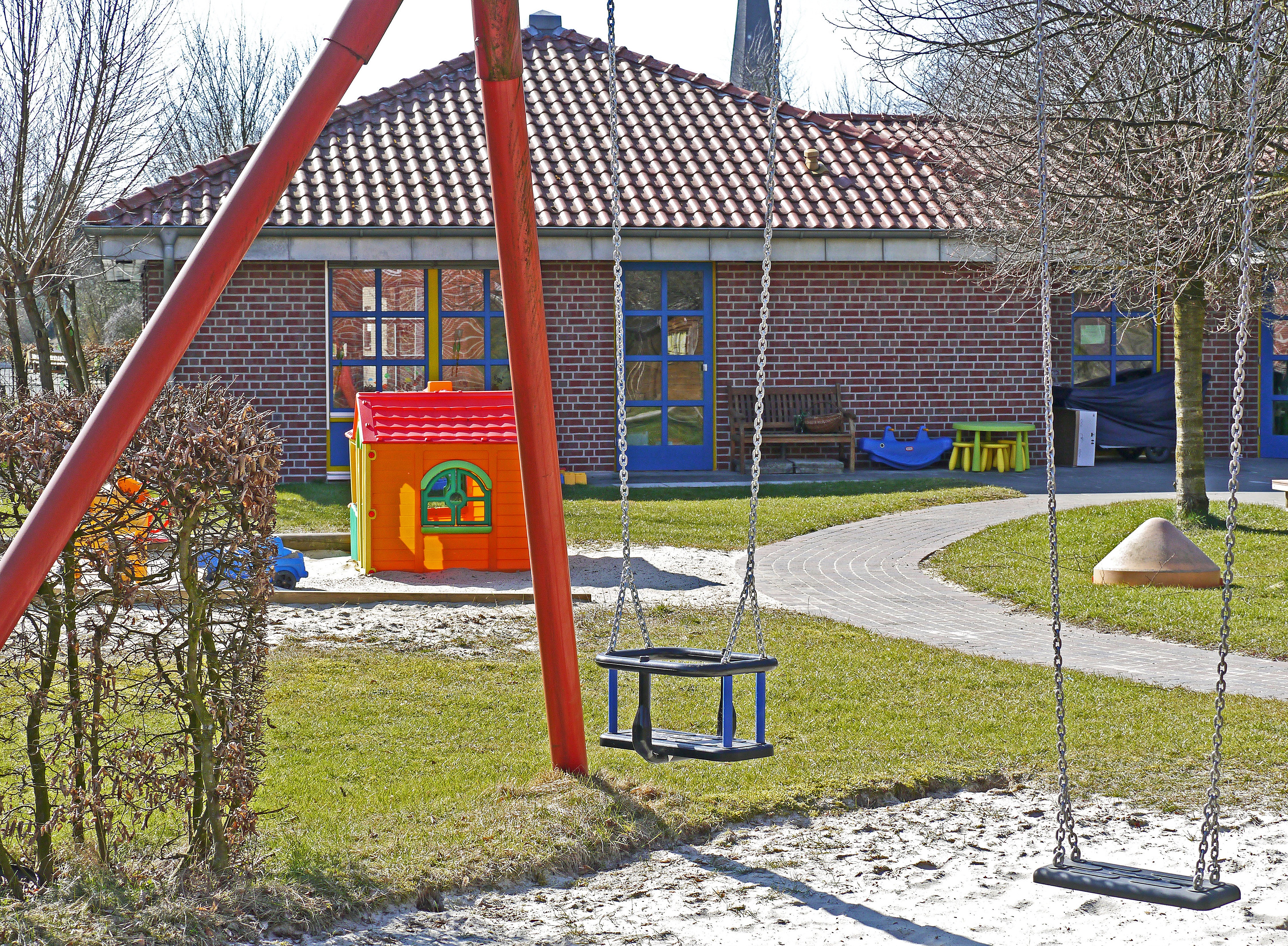 Childcare with lawn and swings, the main workplace for Early Childhood Educators. 